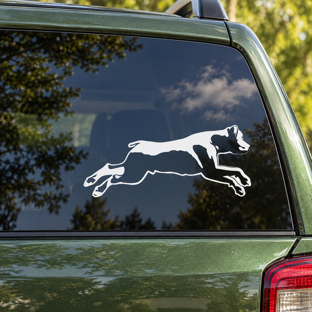 Detailed diving rottweiler decal, white silhouette on car window