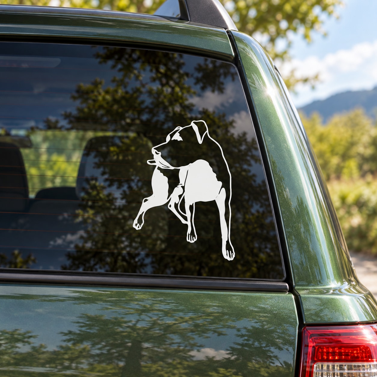 Rottweiler decal with white outline of a sitting dog on a car window