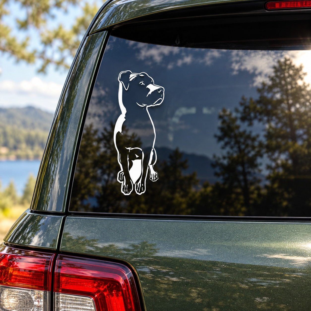 Sitting rottweiler dog decal with white outline on a vehicle side window