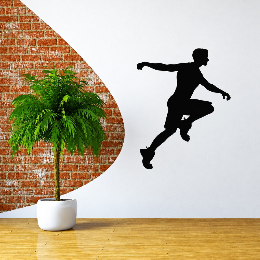 Runner wall decal vinyl sticker of black silhouette jumping forward
