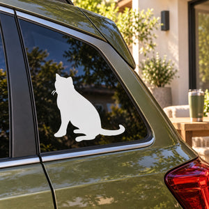 Cat decal silhouette on car window showing seated white cat profile