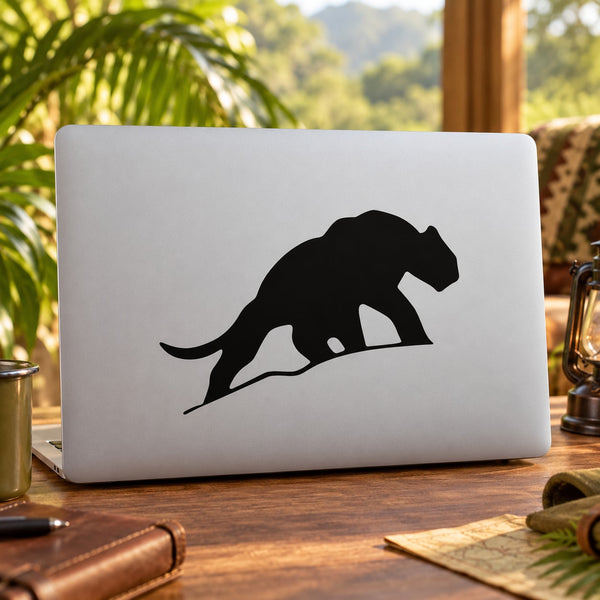 Black saber-tooth tiger silhouette decal on white laptop lid