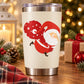 Santa carrying Christmas presents sticker with red Santa and white hat on cream backing