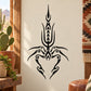 Symmetrical abstract scorpion decal with black tribal-style design on light background