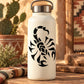 Black scorpion decal with detailed swirl design on a white bottle.