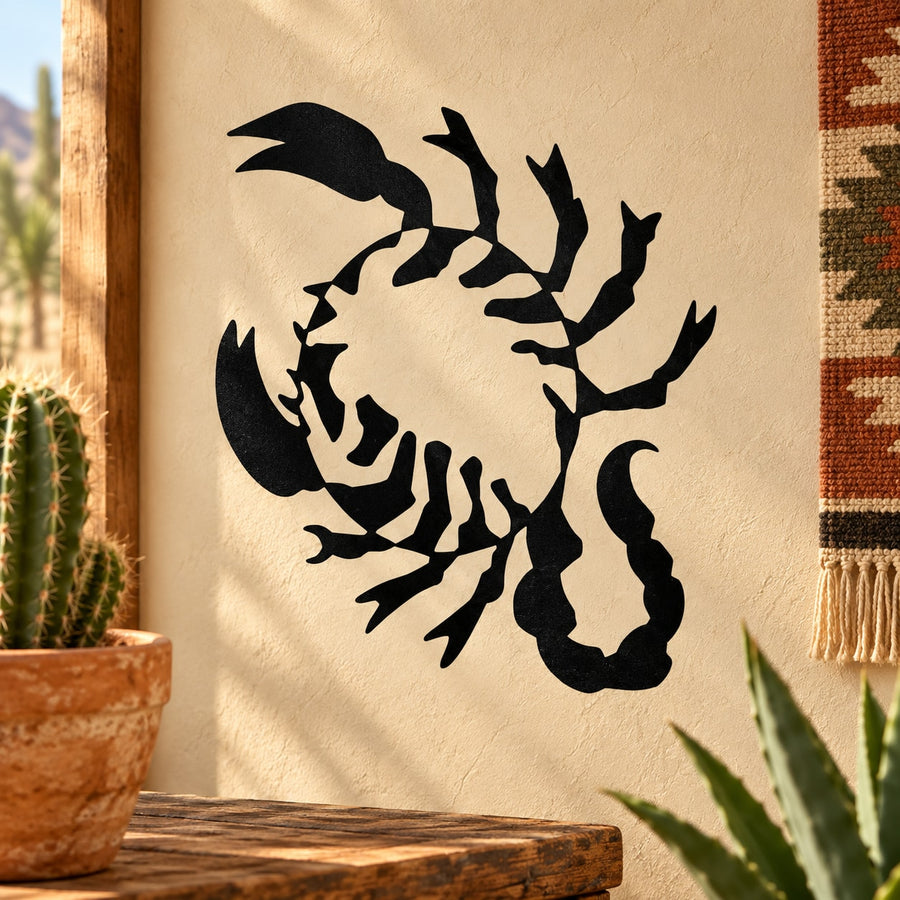 Black scorpion silhouette decal with inner shadow detail on a light surface