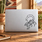 Night scorpion outline decal on light laptop lid, black line art scorpion