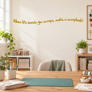 Wall decal text in yellow: “When life hands you scraps, make a scrapbook!”