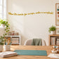 Wall decal text in yellow: “When life hands you scraps, make a scrapbook!”