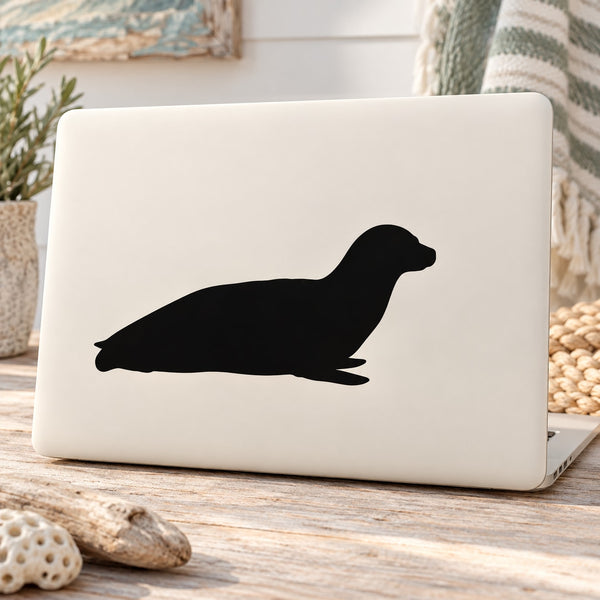 Seated seal decal with black seal silhouette on white backing