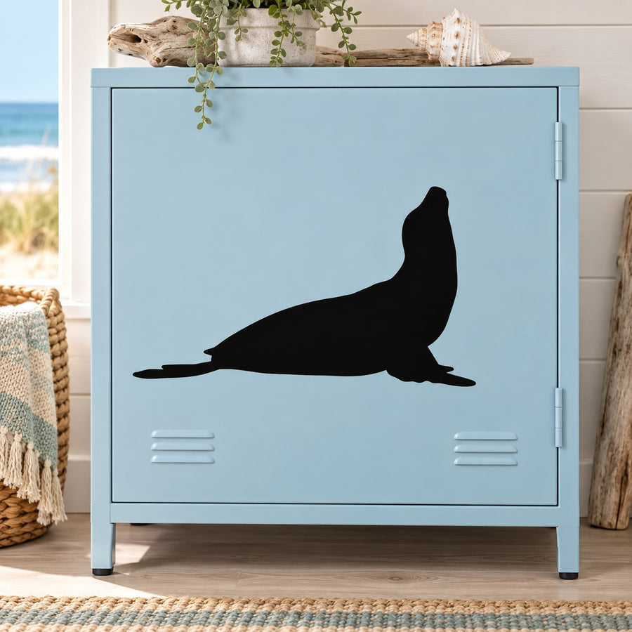 Black raised seal silhouette decal on light blue panel