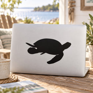 Sea turtle swimming decal with black silhouette on white surface