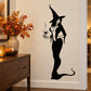 Witch figure wall decal in black silhouette holding a skeleton hand