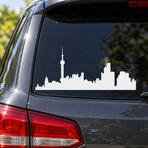 White city skyline decal with tall tower on car rear window