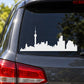 White city skyline decal with tall tower on car rear window
