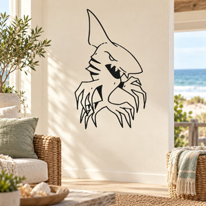 Shark decal sticker with black outline of snarling shark on white surface