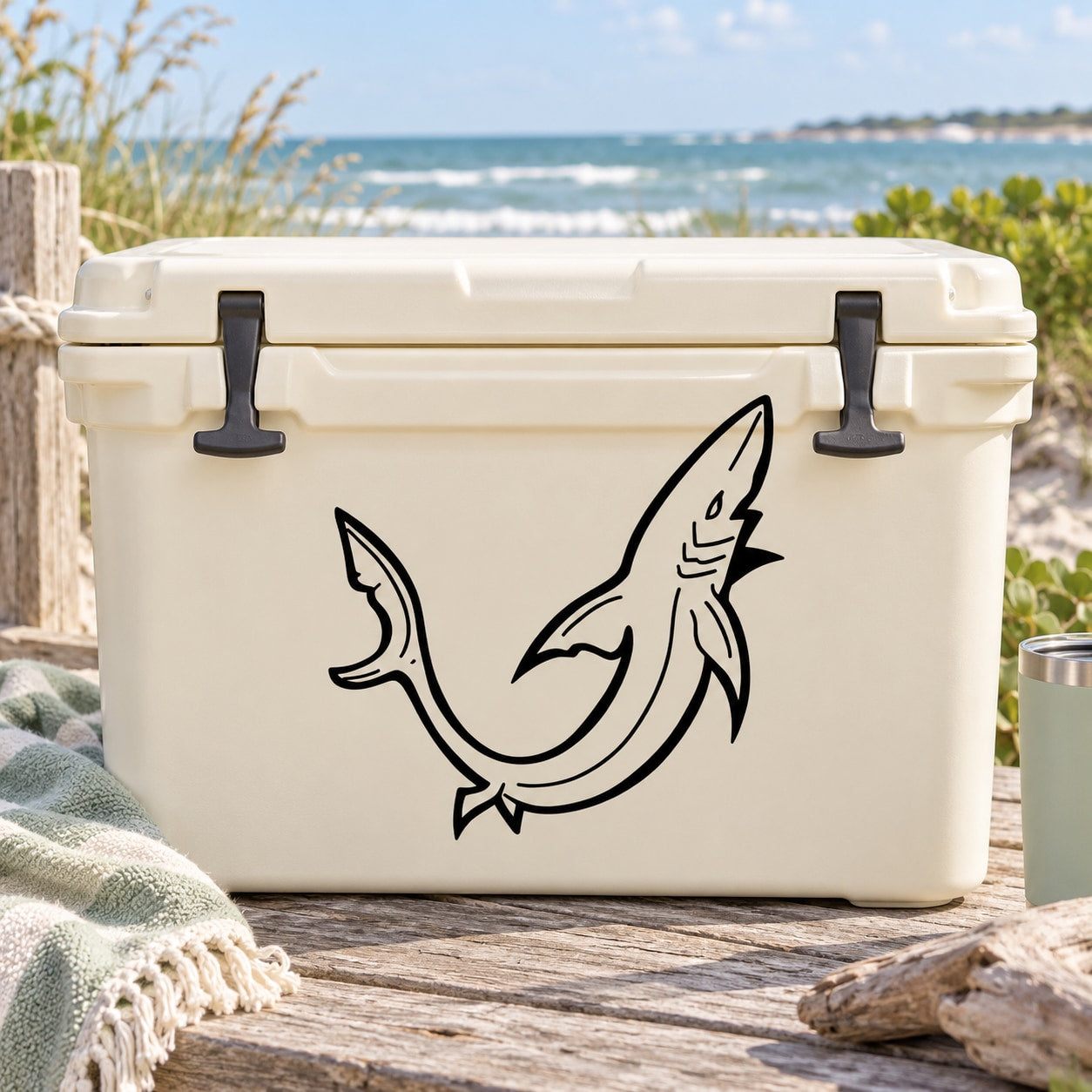Shark turning decal with black illustrated shark on a light cooler lid