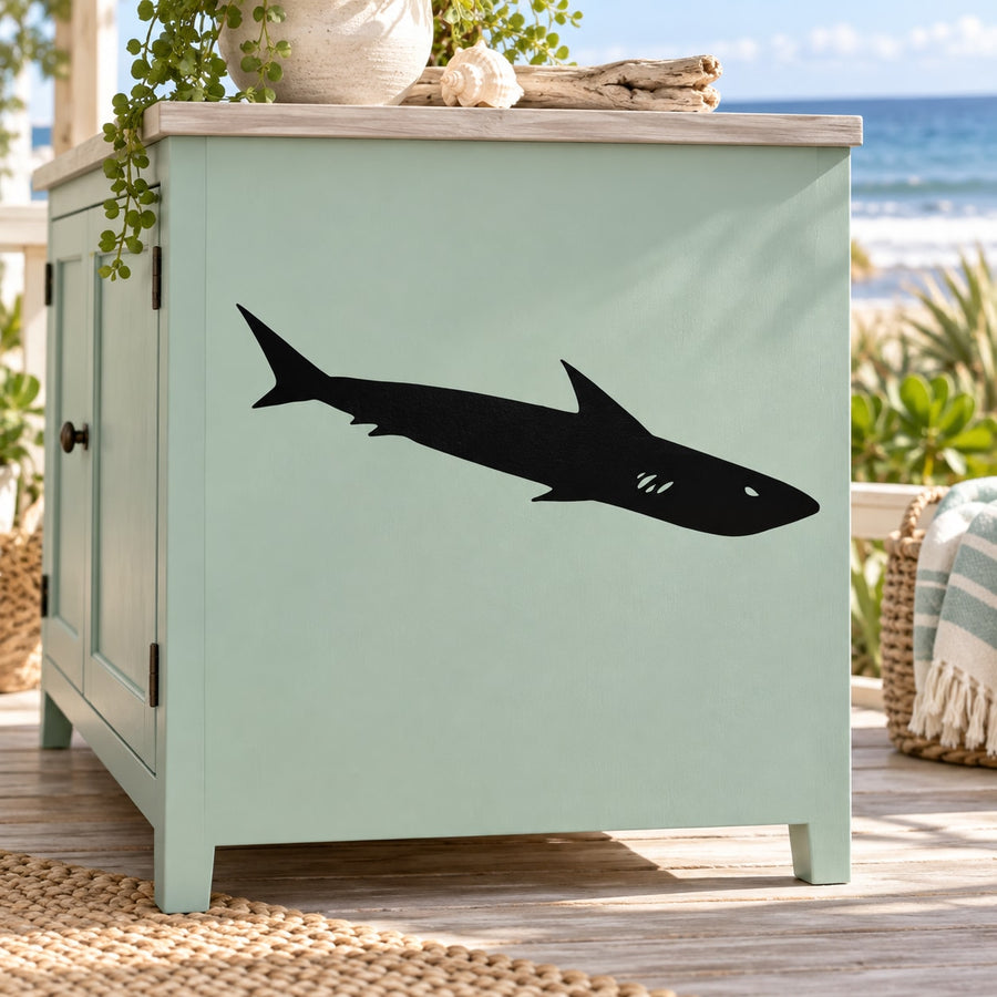 Mako shark decal with dark silhouette on a light green surface