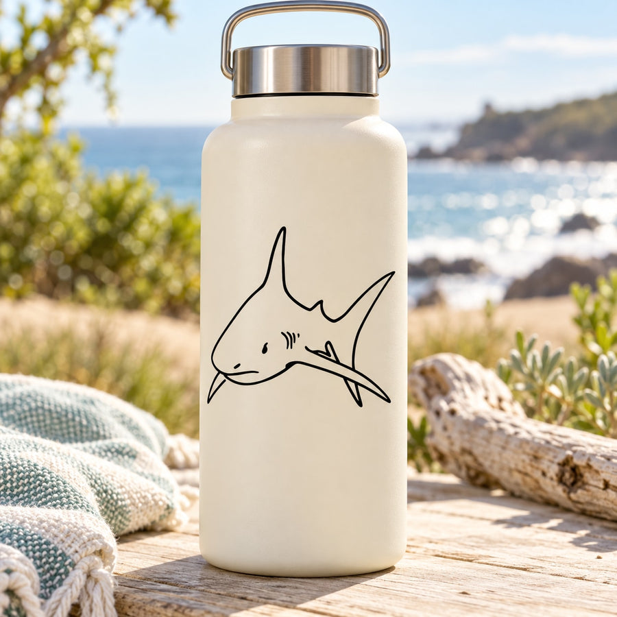 Shark face decal with fin outline on pale water bottle