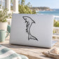 White tip shark line-art decal on light laptop lid