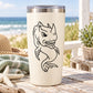 Horned shark decal with bold black outline on light-colored tumbler
