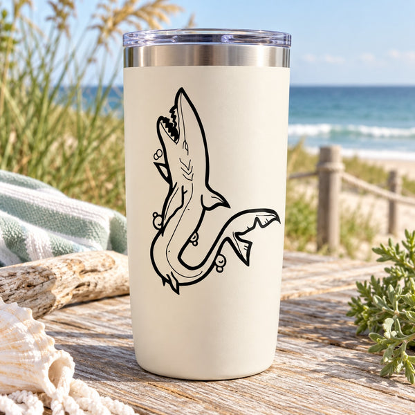 White tumbler with black swimming shark decal graphic on the front