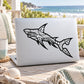 Shark decal with black inuit-style geometric sharks on laptop