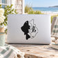 Black fish character decal with Chinese-style characters, applied to a light laptop lid
