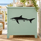 Baby shark decal: black cartoon shark silhouette on light green furniture panel
