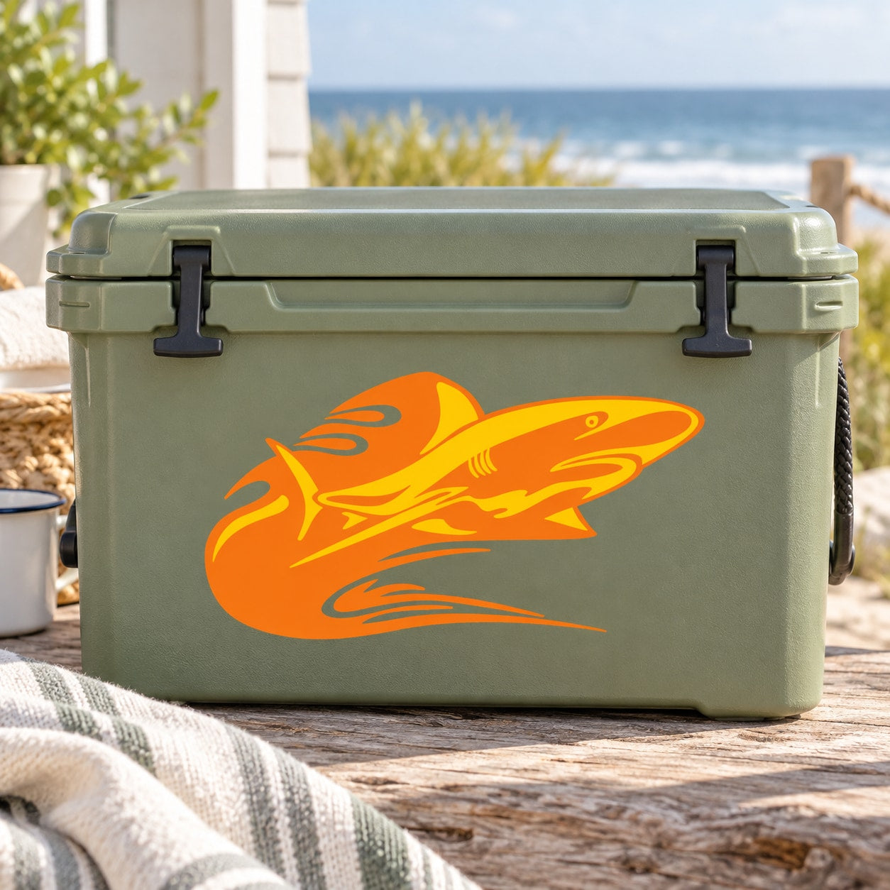 Orange shark flame graphic sticker on a light green cooler