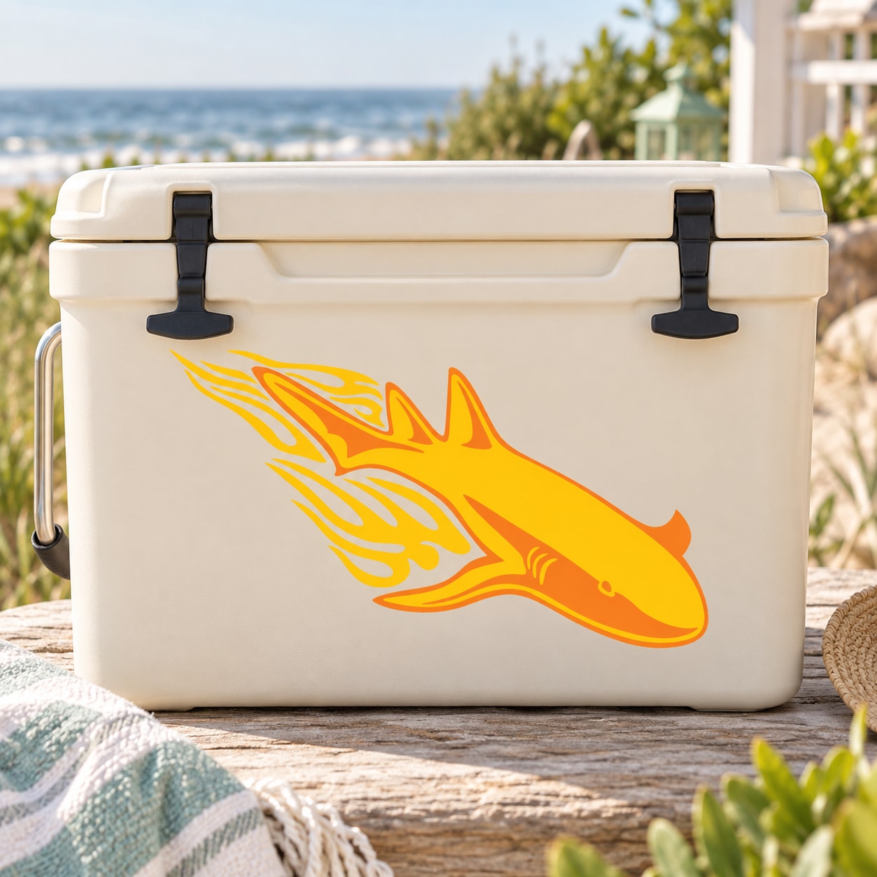 Fire-trail swimming shark sticker on a light cooler, orange and yellow flame graphics
