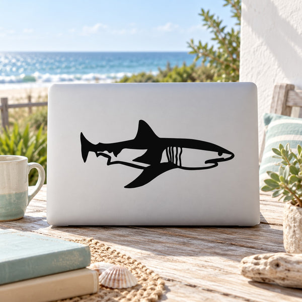 Mako shark decal sticker, black and white stylized fish graphic on light laptop