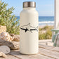 Black lurking shark outline decal on a white bottle