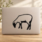 Sheep grazing vinyl decal with black silhouette on a light rectangular surface