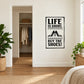 Wall decal with 'Life is short' shoe quote in black and white, framed square.