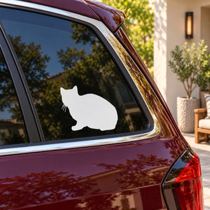 Sitting cat window decal on a car rear side glass, white silhouette