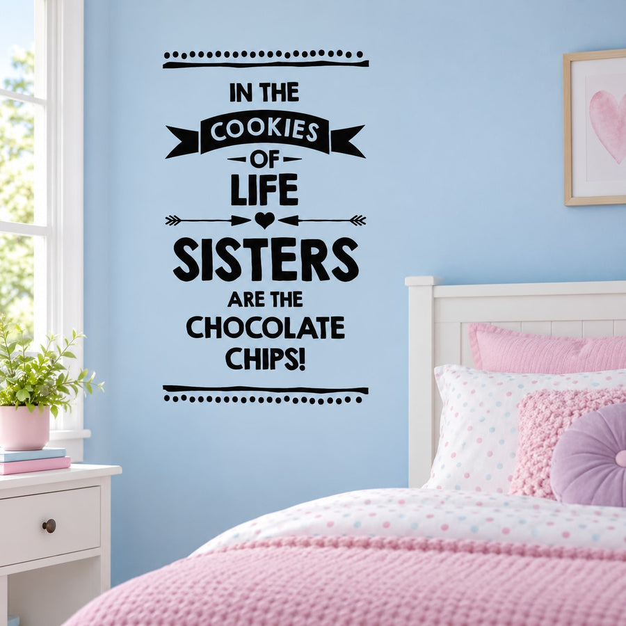 Black wall decal with stacked quote: "In the cookies of life, sisters are the chocolate chips!"