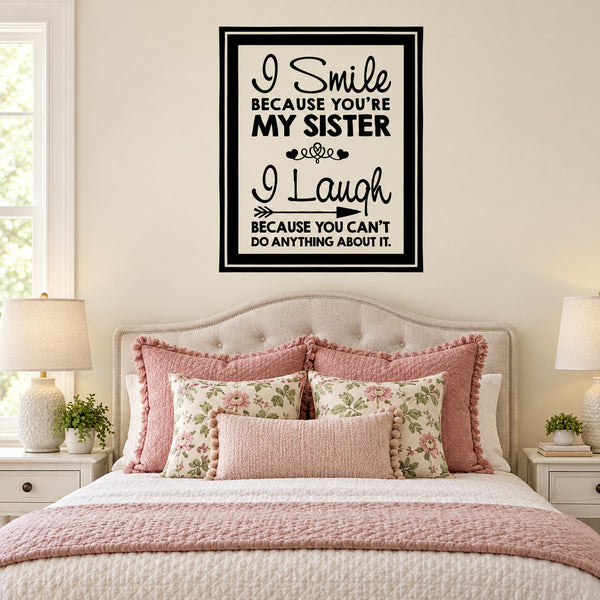 Wall decal with square black frame and quote: “I Smile because you’re my sister”