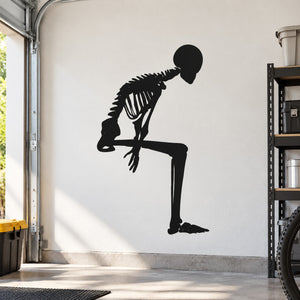 Skeleton sitting decal, black skeleton silhouette on flat surface