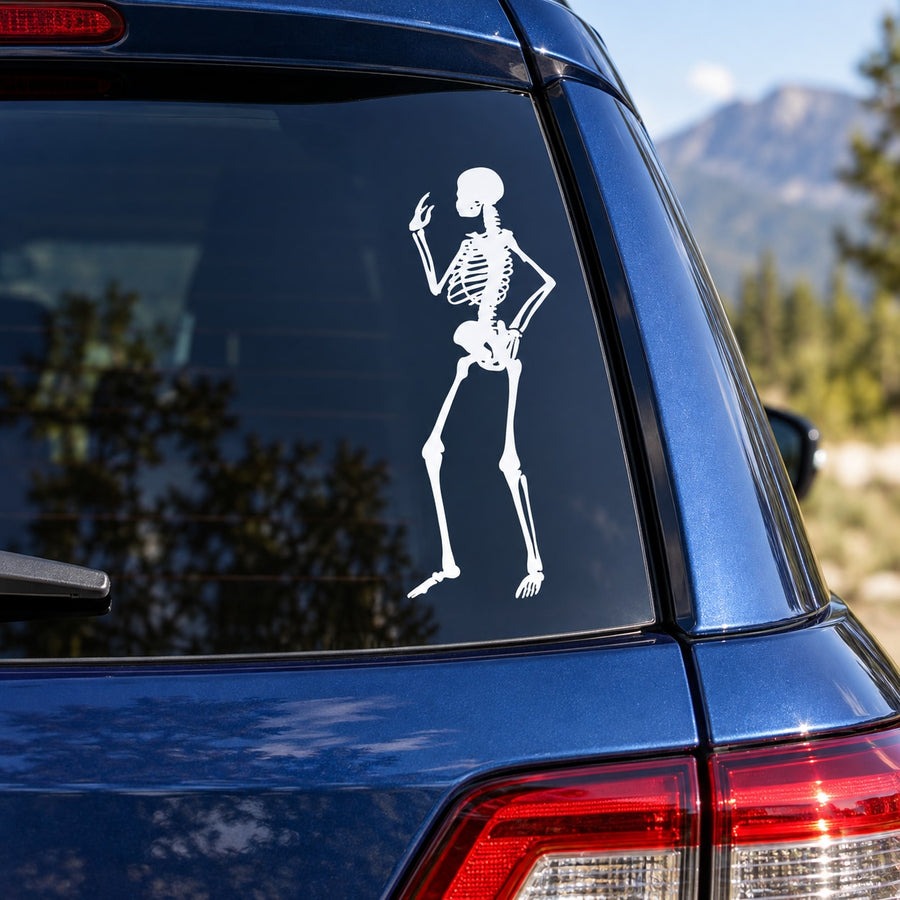 White skeleton pondering decal of a skeleton holding its head, on a car window