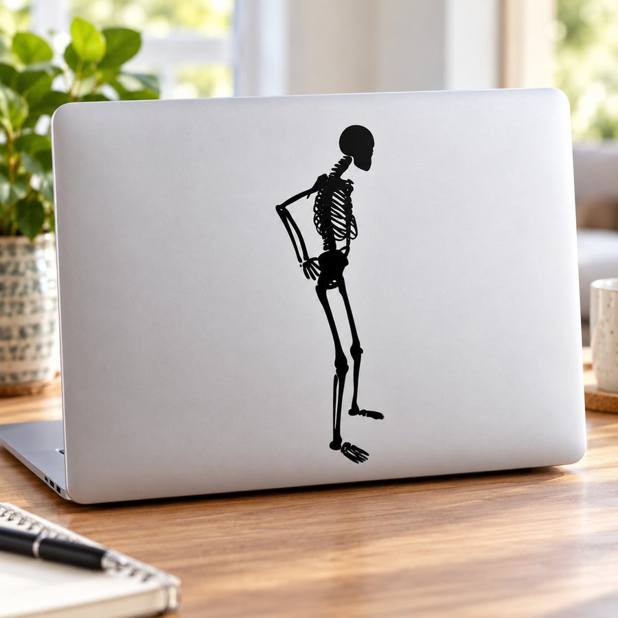 Skeleton contemplating decal silhouette on a light laptop lid