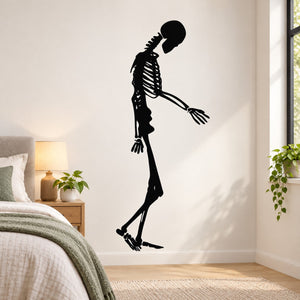 Black skeleton walking wall decal with head down and arms extended