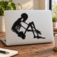 Skeleton holding knees vinyl decal, black silhouette
