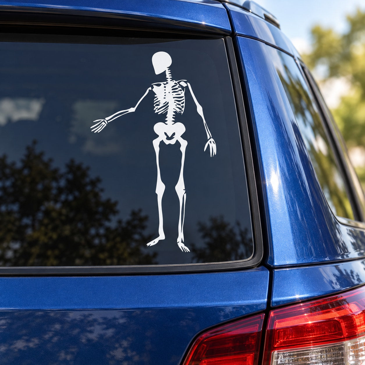 Skeleton hand-gesturing decal, white graphic on car window