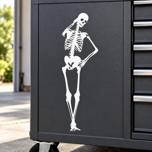 White skeleton decal scratching its head on a dark rectangular panel