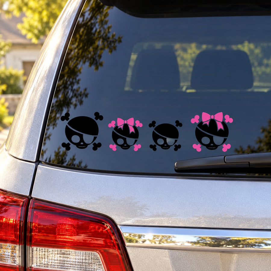 Skull and crossbones family decal kit, three pink bow skull stickers on car window