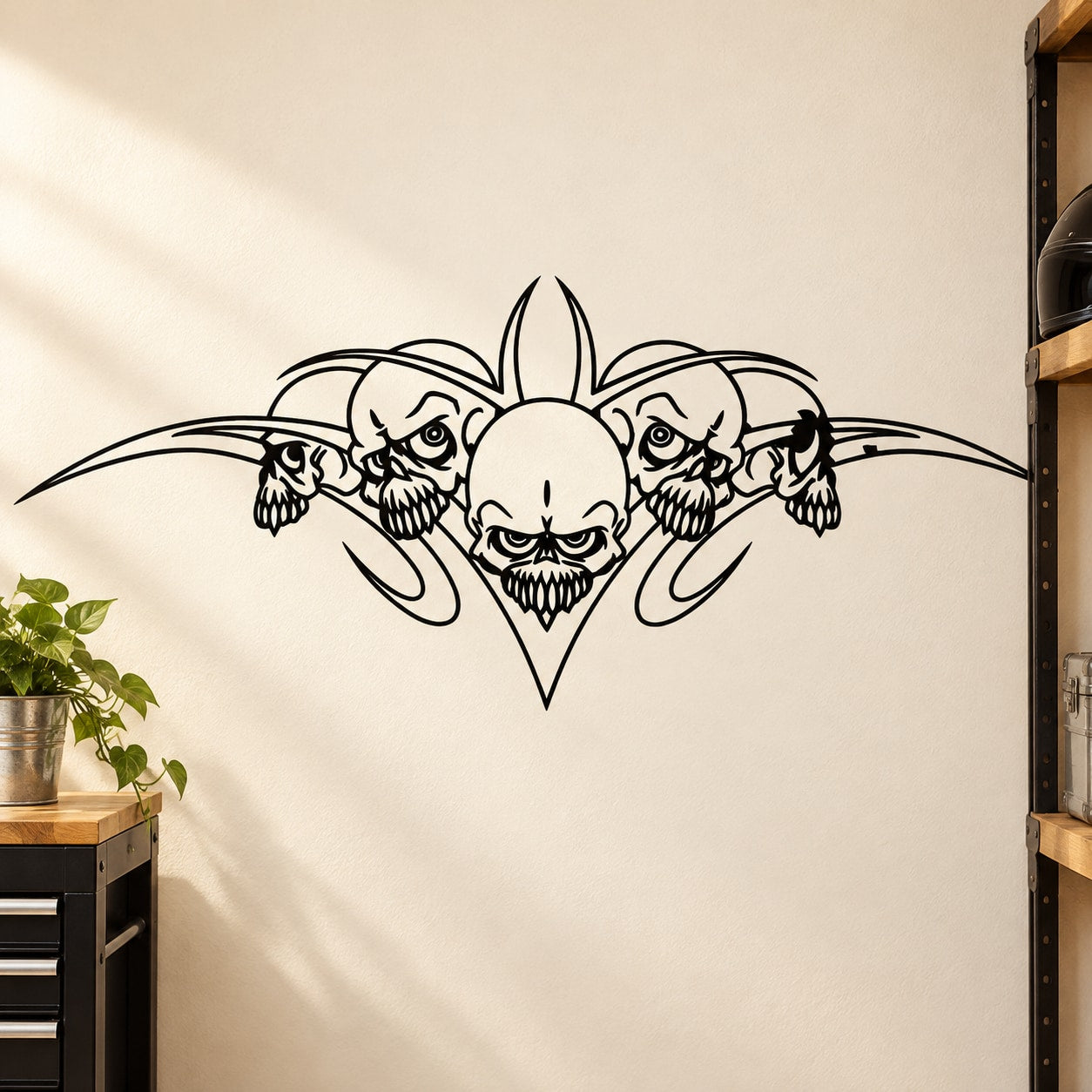 Skull wall vinyl decal with central skull and ornate winged motifs