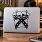 Skull wall decal vinyl sticker with two black skulls, star accents, crossed ribbon design