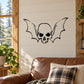 Skull and wing head wall decal with black outline on light background
