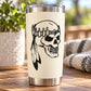 Skull face vinyl decal on stainless travel tumbler, black artwork on light background